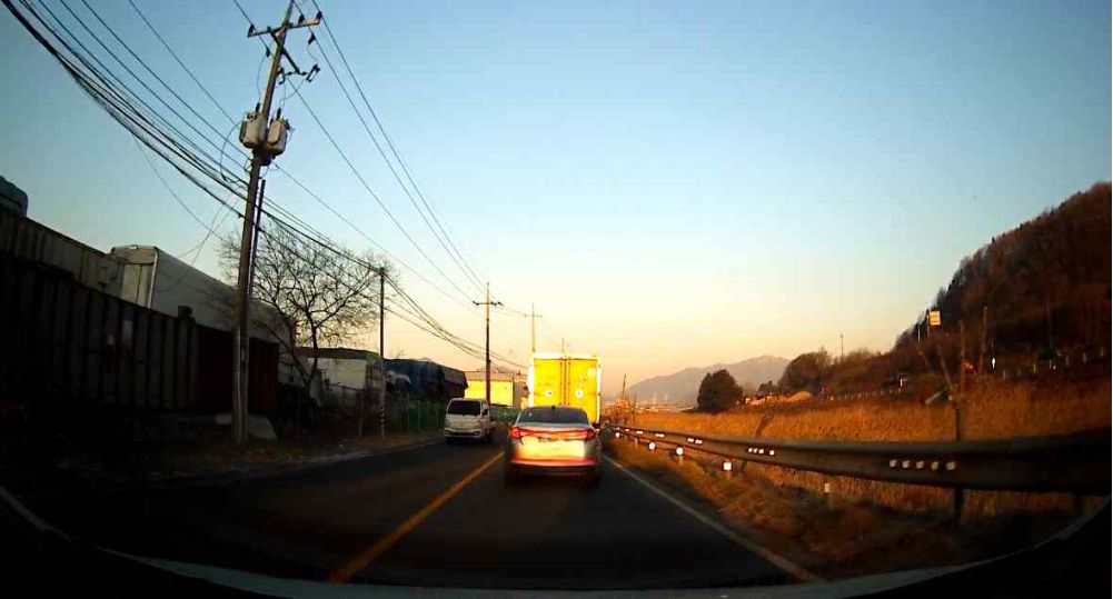 Around sunrise · Solid center line, vehicle driving ahead · Oncoming vehicle