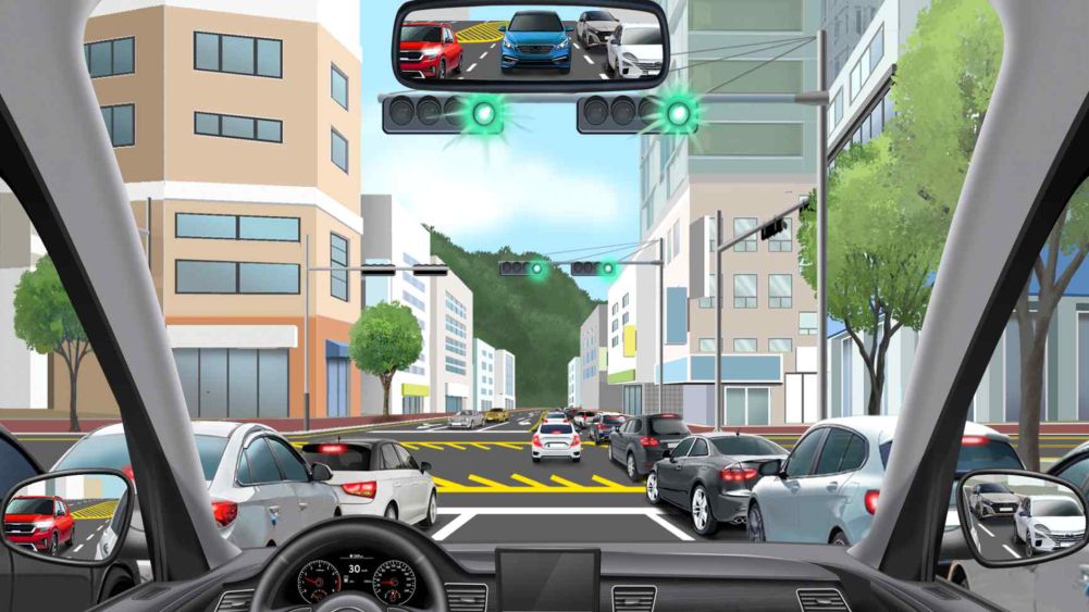 + shaped intersection · Lane 1 (left turn), lane 2 (straight), lane 3 (straight/right turn) · 4-light signal on green · Vehicles congested ahead · Driving in lane 2