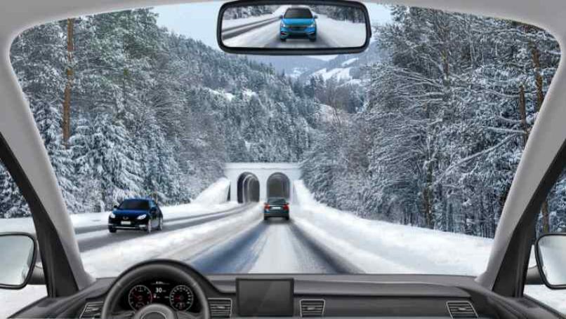 Snow-covered road · About to enter the tunnel ahead