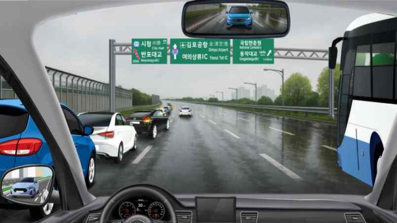 Rain-soaked motorway (motor-vehicle-only road) · Lane 1 congested by vehicles exiting toward City Hall