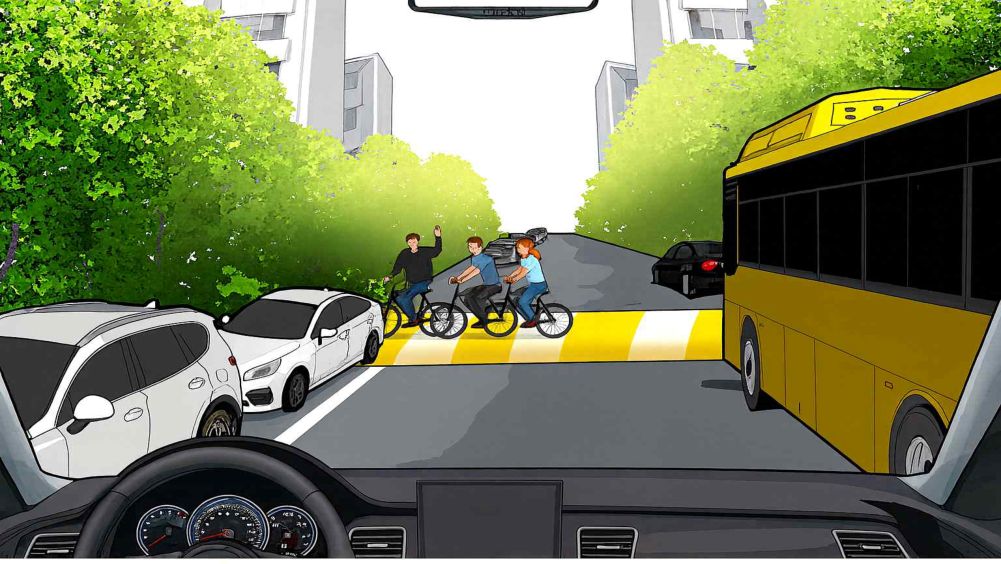 Back street · A large bus parked on the right · Vehicles parked in resident-priority parking spaces · A cyclist crossing the road