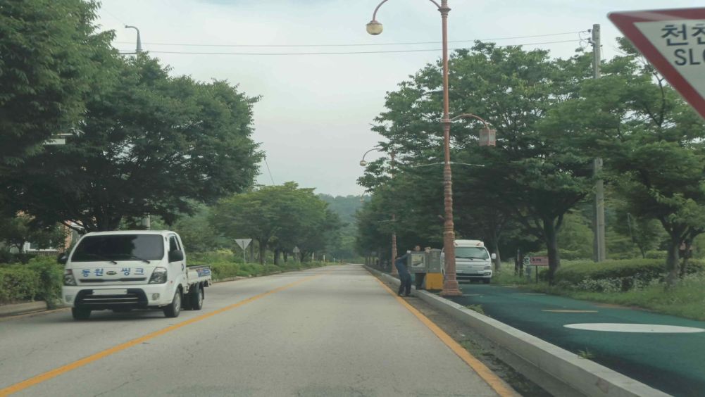 Street light inspection ahead on the right · Sidewalks on both sides of the road
