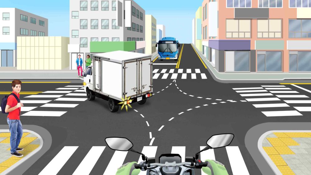 About to turn left at an intersection without traffic lights · A pedestrian waiting to cross on the left side of the crosswalk · A box truck ahead is turning left · A large bus approaching the intersection on the opposite road