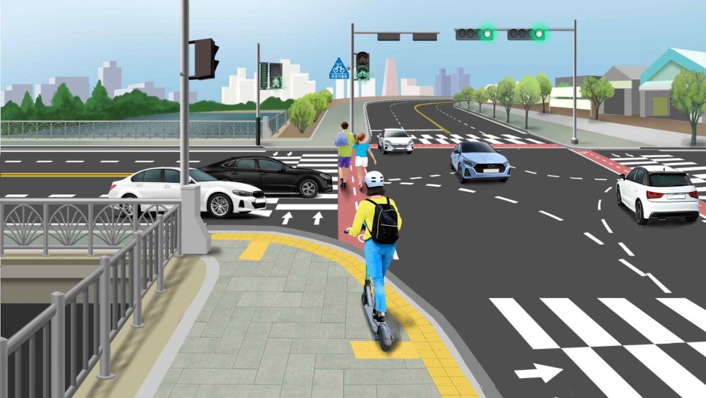 The bicycle crossing signal is green · Two cars are stopped on the crosswalk